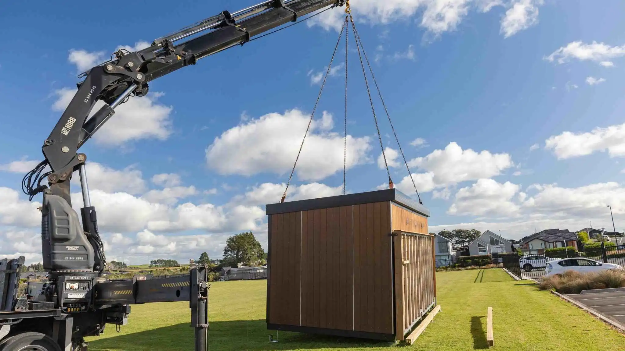 Crane moving a building into place during the Outclass Hub installation filmed for Outdorable Ltd.