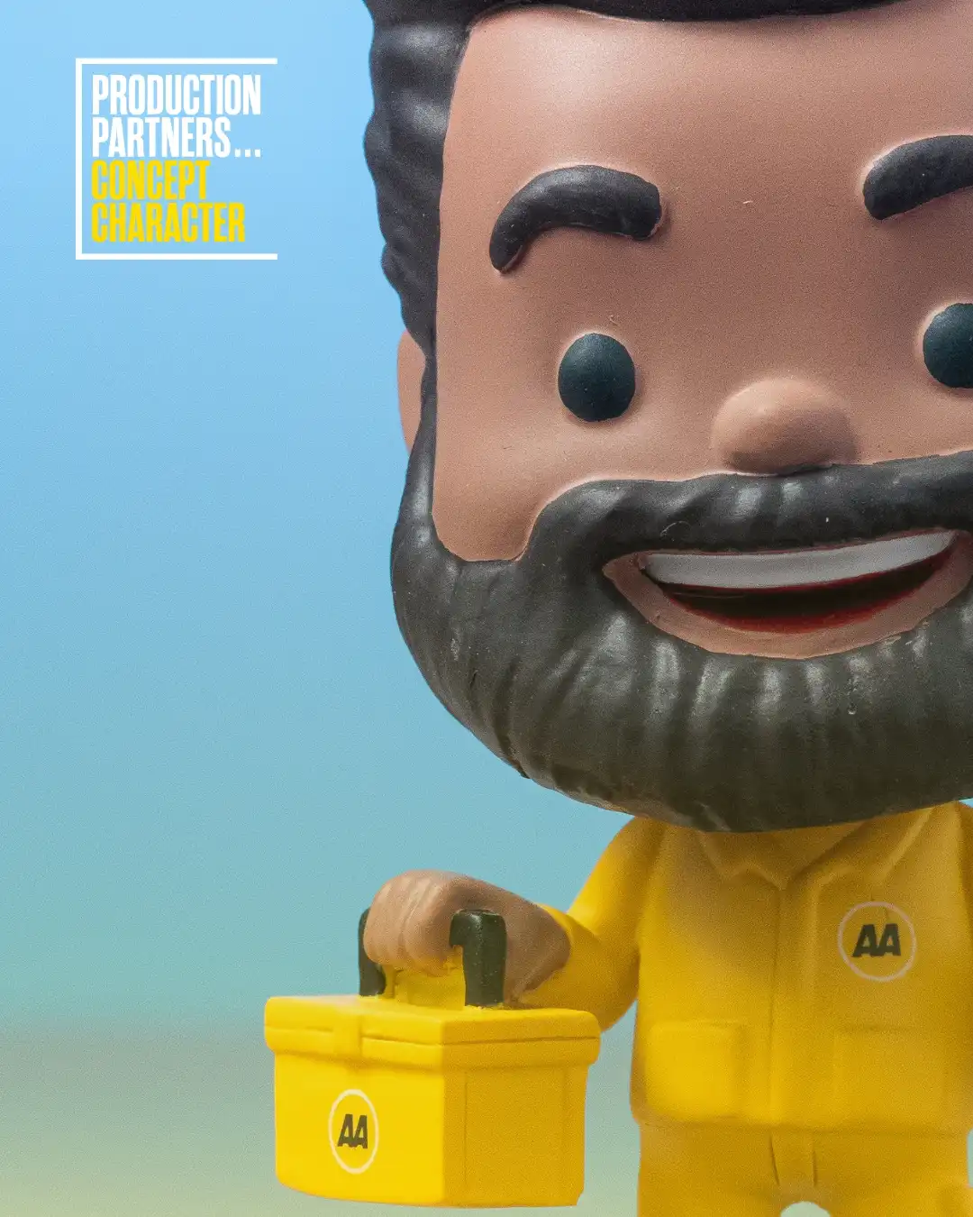 AA worker figurine holding toolbox.