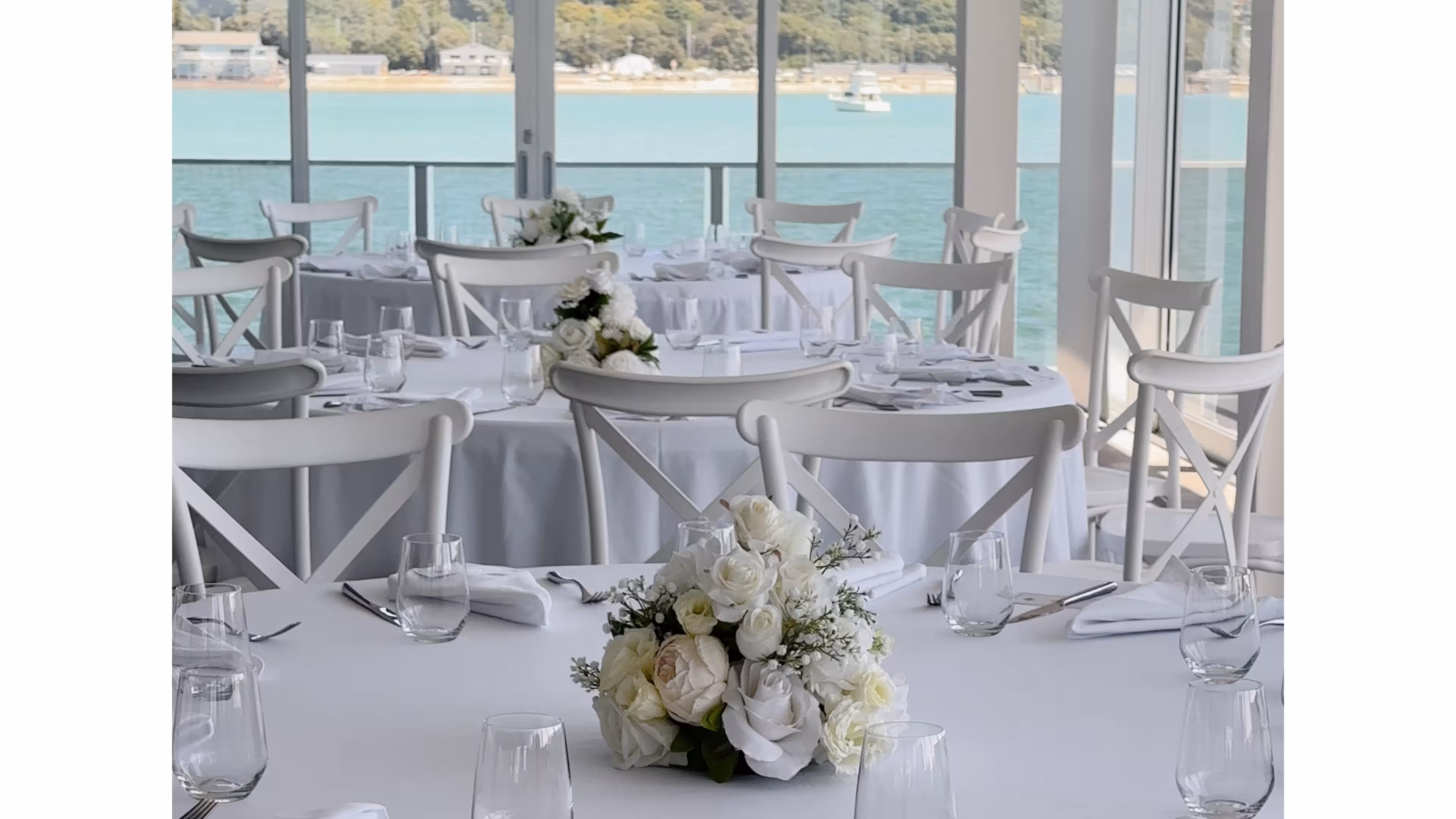 Ceremony setup at Okahu Bay waterfront Auckland wedding venue